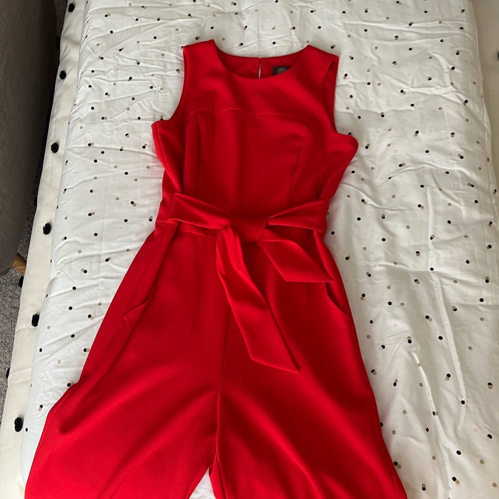 Tomato red belted jumpsuit.